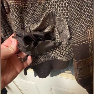 Brown/tan winter coat.